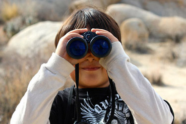 Boy Looking Through Binoculars